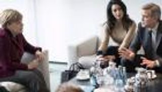 جورج وأمل كلوني يبحثان أزمة اللاجئين مع ميركل