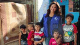 بالصور.. هند صبري في زيارة للاجئين السوريين في لبنان