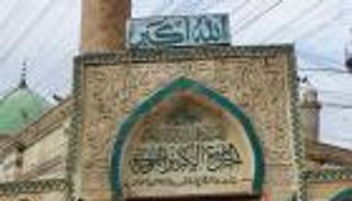 علم العراق يرفرف فوق جامع "الخلافة المزعومة" بالموصل