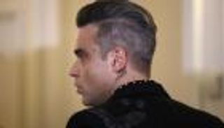 روبي وليامز يتوقع عودته إلى فريق غنائي بعد انفصال 21 عاما