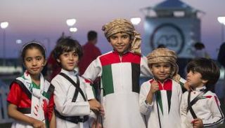 أطفال يحتفلون باليوم الوطني