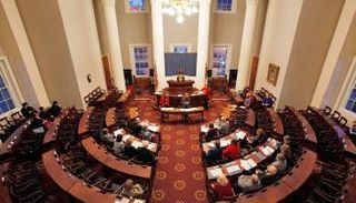 أعضاء من المجمع الإنتخابي الأمريكي في أحد الإجتماعات - رويترز