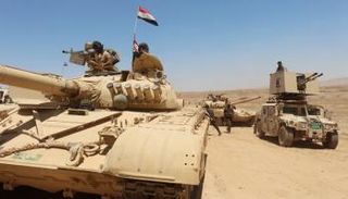 قوات عراقية تتجمع استعدادا لقتال تنظيم داعش جنوبي الموصل