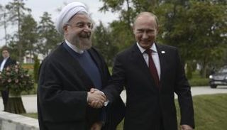 بوتين وروحاني في لقاء سابق (أرشيفية)