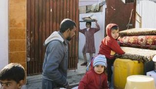 أطفال عراقيون داخل منازلهم في معركة الموصل