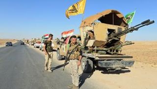 مليشيا الحشد الشعبي إلى جانب القوات العراقية في كركوك - رويترز