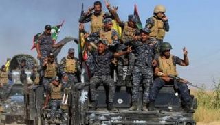 القوات العراقية تلوح بعلامات النصر في كركوك