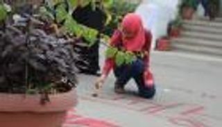 بالصور.. المصرية هدير ناجي تحلم بتألق الخط العربي عبر "الجرافيتي"