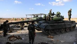 قوات النظام السوري في البوكمال- أ.ف.ب