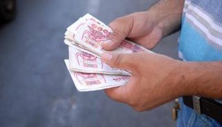 تدهور قيمة الدينار الجزائري
