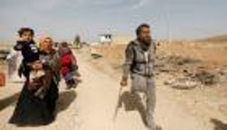 15 صورة لهروب الإنسانية من "داعش" في الموصل.. ذعر وابتسامة أمل