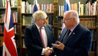 ريفلين خلال اجتماع مع جونسون بالقدس