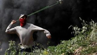 اشتباكات بعد تظاهرة اعتراضا على مستوطنة بالضفة الغربية