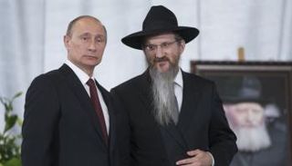 لازار بجوار الرئيس الروسي (أرشيفية)