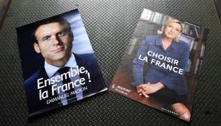 مارين لوبان وإيمانويل ماكرون  - الفرنسية