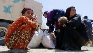 استمرار عمليات النزوح من غرب الموصل- أ.ف.ب