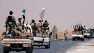 مقاتلو قوات سوريا الديمقراطية في طريقهم إلى الرقة - رويترز