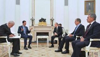 لقاء سابق بين بوتين والرئيس السوري بشار الأسد (أرشيف)