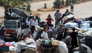 صور المسلحين حين رحيلهم من حمص إلى شمال سوريا