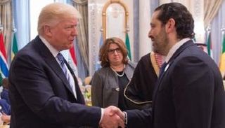 مصافحة بين ترامب والحريري بالقمة العربية الإسلامية الأمريكية بالرياض 