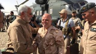 العبادي مع المهندس نائب مليشيا الحشد الشعبي