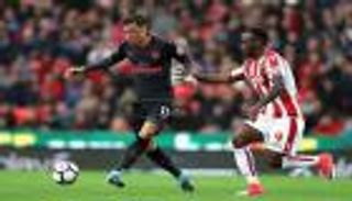 فينجر يرد على انتقادات جيرارد لأوزيل