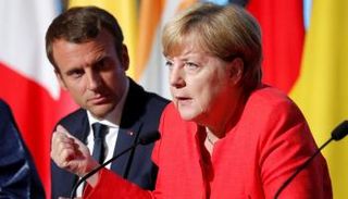 ميركل وماكرون اتفقا على تشديد العقوبات على بيونج يانج (رويترز)