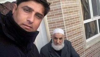 شرطي عراقي مع الإرهابي 