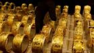 الذهب يتراجع مع استفادة الدولار من تيسير نقدي صيني