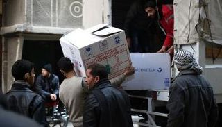 قافلة مساعدات إنسانية تصل الغوطة - أرشيفية