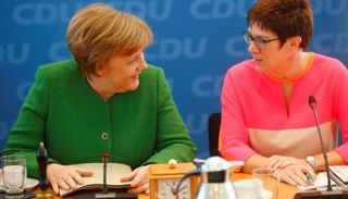 ميركل وكرامب - رويترز