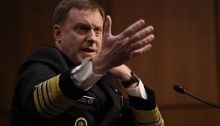 مايكل روجرز أثناء الإدلاء بشهادته أمام الكونجرس- أ.ف.ب