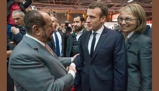 الشيخ سلطان القاسمي وماكرون في المعرض