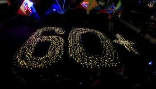 المصابيح الخفيفة تشكل رقم 60 دلالة على ساعة الأرض