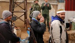 عناصر من الفصائل المسلحة بحمص (أرشيف)