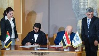 أثناء توقيع الاتفاقية