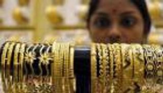 الذهب يتراجع أمام قوة الدولار