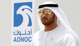  إماراتي قرب شعار أدنوك في الرويس - رويترز