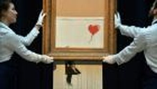 لوحة بانكسي التي تمزقت تلقائيا تعرض في ألمانيا