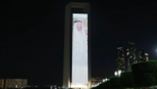 مبنى أدنوك يتزين بعلمي الإمارات ومصر وصورتي محمد بن زايد والسيسي