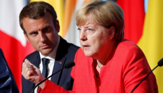 المستشارة الألمانية والرئيس الفرنسي في لقاء سابق