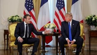 ترامب وماكرون - رويترز