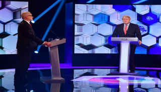 بوريس جونسون (المحافظين) وجيرمي كوربن (العمال) خلال مناظرة - رويترز