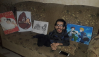 محمد الدلو.. شاب فلسطيني يقهر إعاقته بالفن ويطمح للعالمية بإصرار