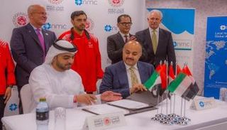 أثناء توقيع مذكرة التفاهم بين NMC Healt واللجنة المنظمة للأولمبياد