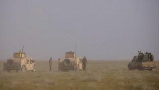 آليات تابعة لقوات سوريا الديمقراطية في الباغوز