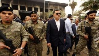 السراج وسط عناصر مليشياته في طرابلس - أرشيفية