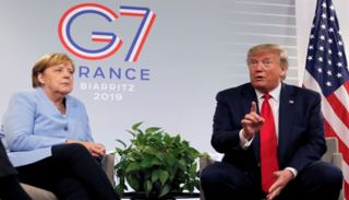 دونالد ترامب وأنجيلا ميركل خلال قمة مجموعة السبع - رويترز
