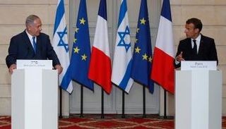 جانب من المؤتمر الصحفي المشترك بين ماكرون ونتنياهو