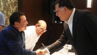 السراج ووزير إعلامه محمد عمر بعيو